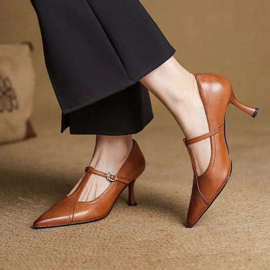 Elegant black T-strap heels for women, perfect for formal events and dressy occasions.