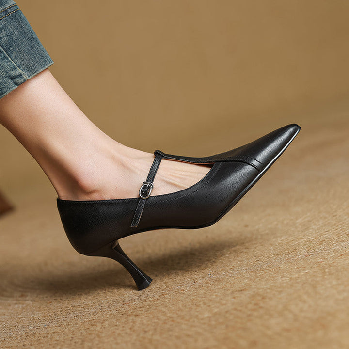Sophisticated black T-strap heels, women's dress shoes for formal or party looks.