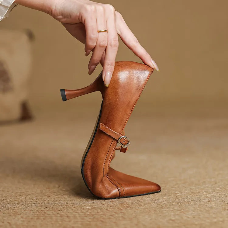 Brown T-strap elegant heels, versatile women's shoes for parties or office wear.
