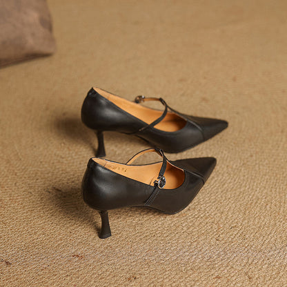 Women's elegant T-strap mid-heel shoes in black, suitable for formal wear and parties.