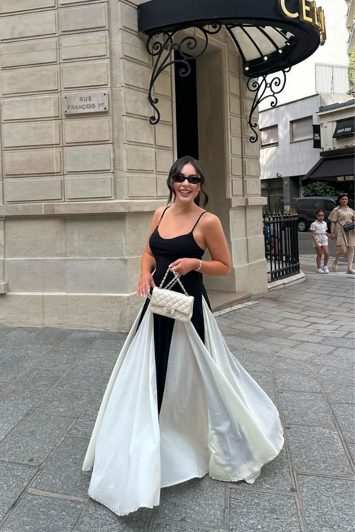 Women's formal black & white maxi wedding guest dress, elegant evening gown with flowing godet panels.