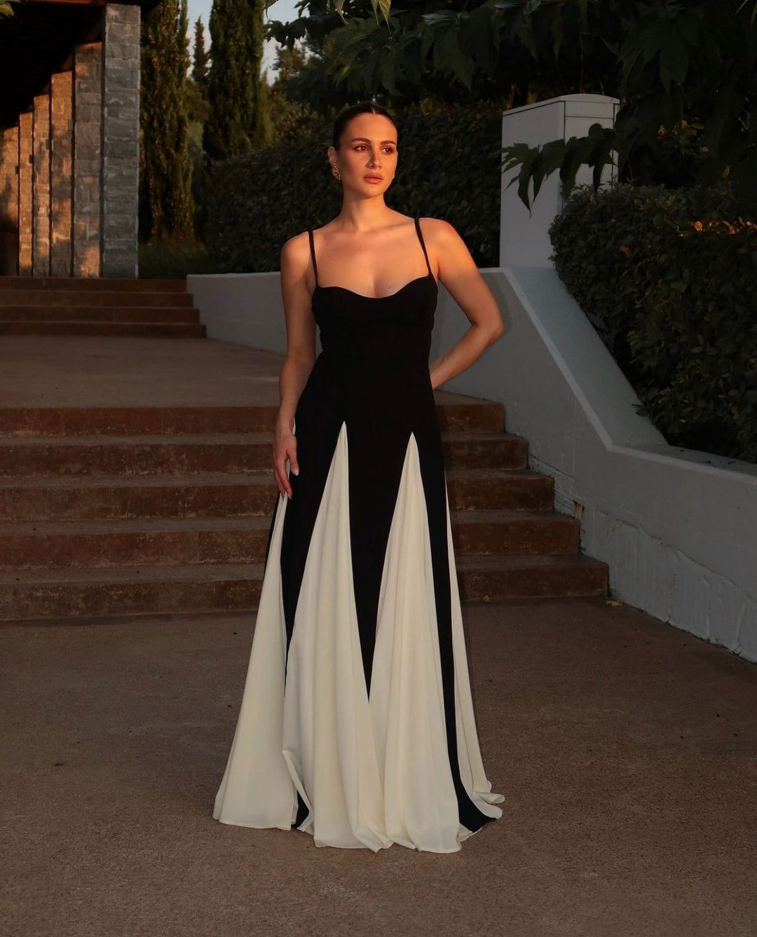 Close-up of the sweetheart neckline on a women's black & white contrast formal evening maxi dress.