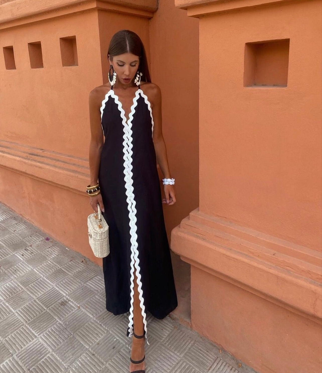 Elegant black & white contrast V-neck maxi wedding guest dress, sleeveless. Perfect for formal summer occasions.