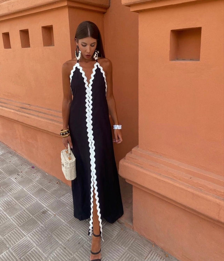 Elegant black & white contrast V-neck maxi wedding guest dress, sleeveless. Perfect for formal summer occasions.