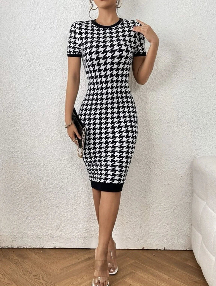 Comfortable, elegant houndstooth knit midi dress. Versatile black & white long sleeve style for women.