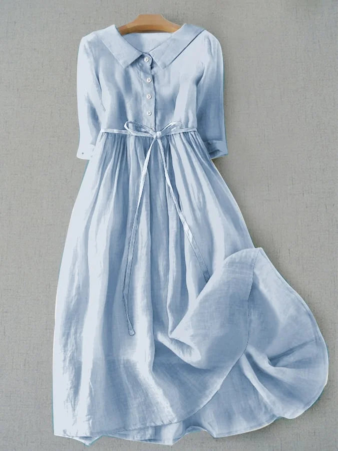 Elegant blue women's half-sleeve dress with lace-up waist, perfect for summer casual or special occasions.