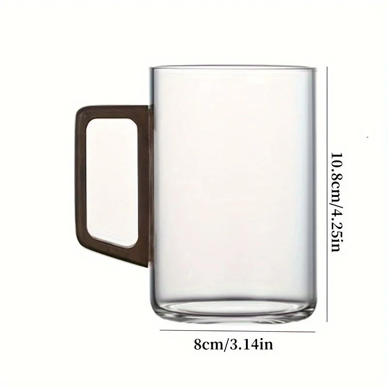 Modern borosilicate glass tea cup or coffee mug with a unique ergonomic walnut wood handle.