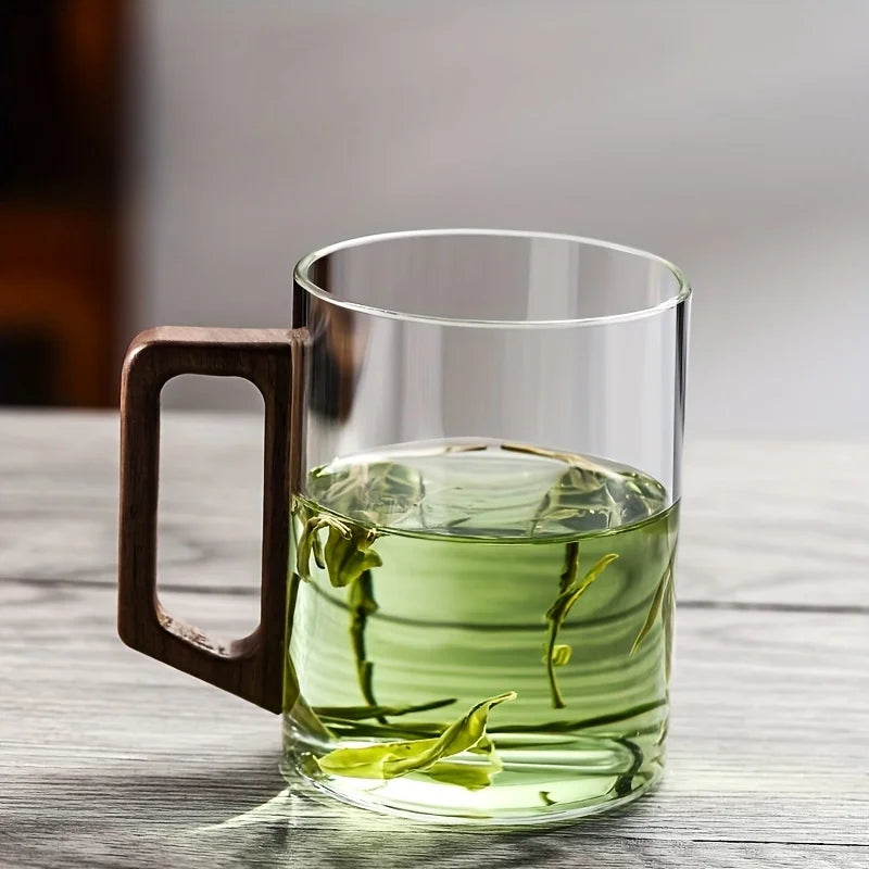 Gift-ready elegant glass mug with a warm walnut wood handle, perfect for coffee or tea lovers.