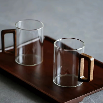 Durable borosilicate glass coffee mug, showcasing a beautiful contrasting walnut wood handle.