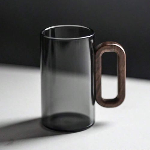 Durable borosilicate glass coffee mug with a sleek design and comfortable walnut handle. Great for daily use.