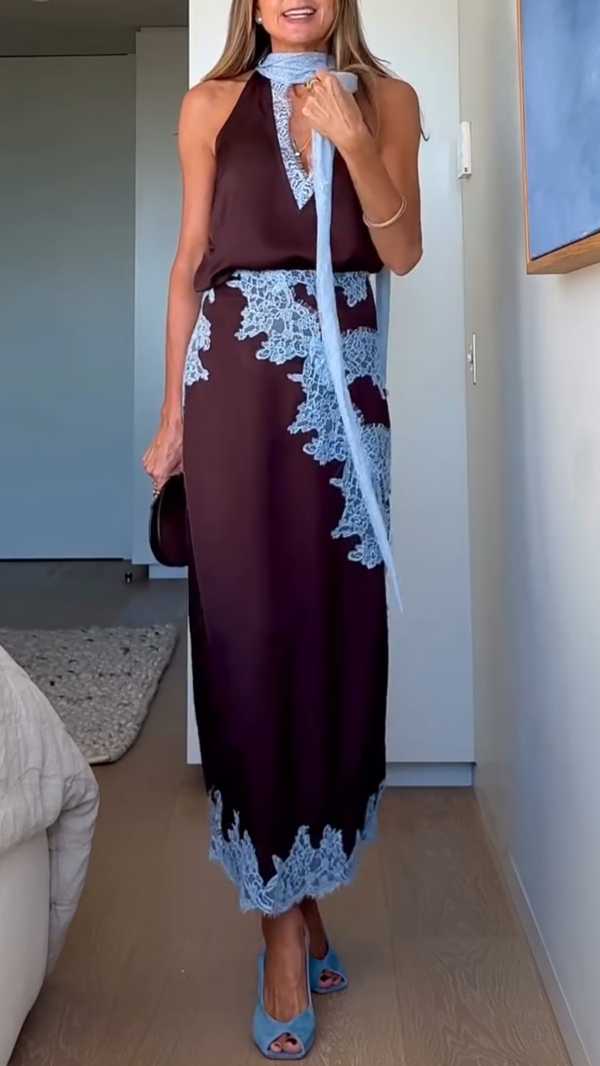 Women's flowing brown maxi dress with a unique tie-dye print, elegant halter V-neck, and high slit.