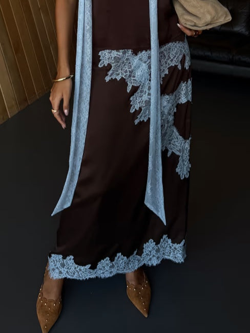 Elegant brown women's maxi dress, tie-dye pattern, comfortable halter V-neck, and high slit.