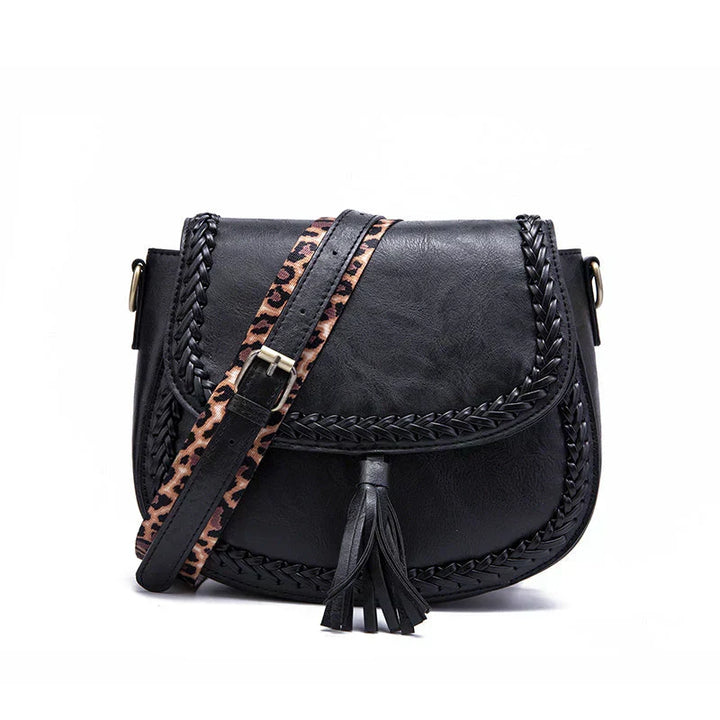 Versatile black women's crossbody bag, featuring an elegant tassel. A chic shoulder handbag for any daily outfit.