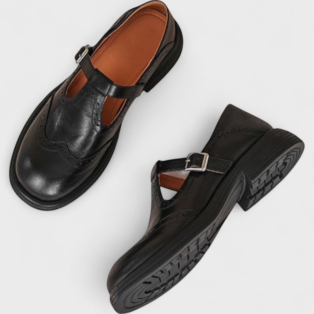 Elegant Women's black Mary Jane slip-on shoes. Versatile classic flat design with superior comfort.