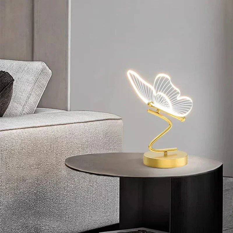 Modern LED desk lamp with unique butterfly design, ideal for bedroom or living room lighting.