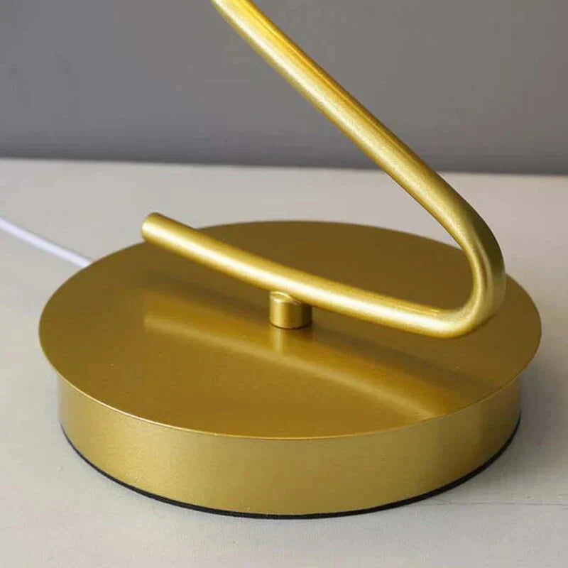 Sleek modern LED table lamp featuring an elegant butterfly design, perfect for home accent lighting.