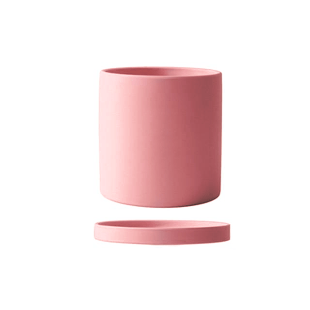 Indoor garden ceramic flowerpot, includes saucer for easy plant care and styling.