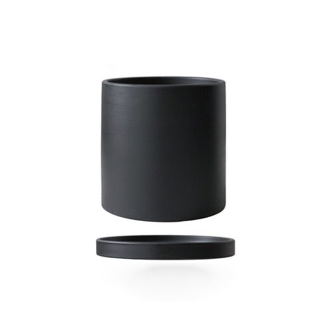 Durable ceramic flowerpot & saucer, a chic addition to any indoor plant collection.