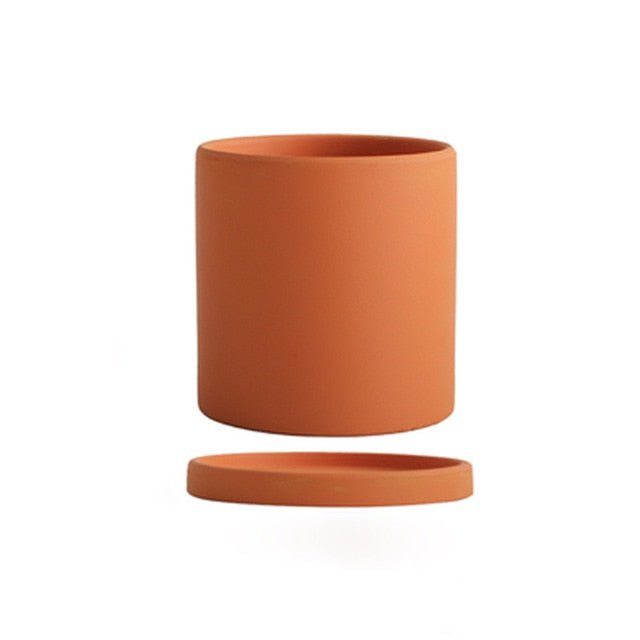Contemporary ceramic planter with saucer, enhancing any indoor living space.