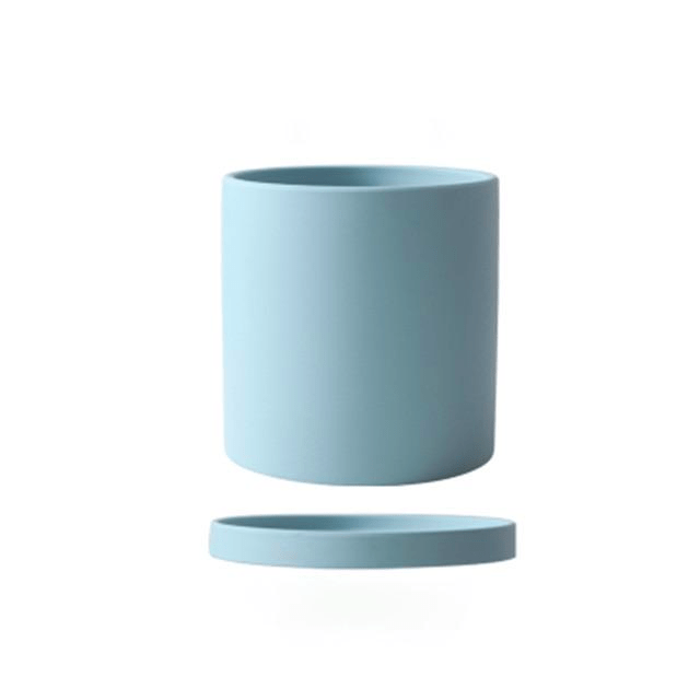 Modern home decor ceramic flowerpot with integrated saucer for easy watering.