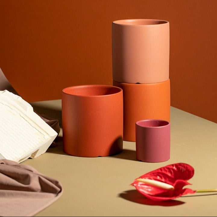 High-quality ceramic planter with a saucer, ideal for home decor & plant health.