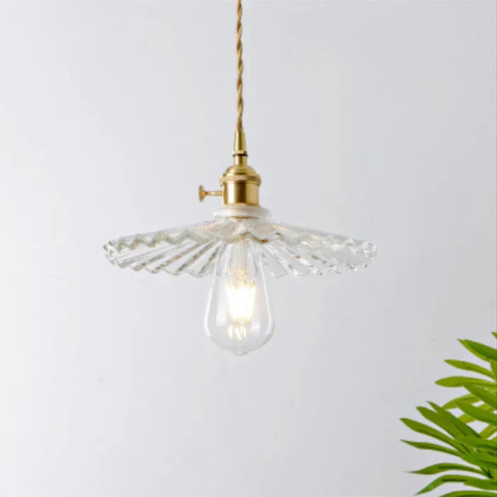 Minimalist clear glass hanging lamp for modern home decor.