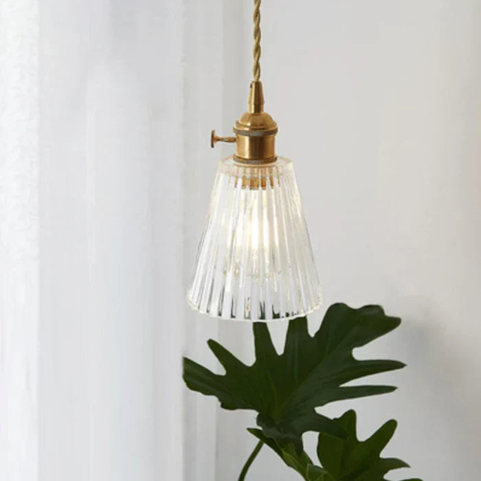 Elegant glass lighting solution for stylish dining room decor.