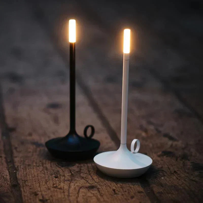 Dimmable LED table lamp with a sleek modern design, offering cordless convenience for home decor.