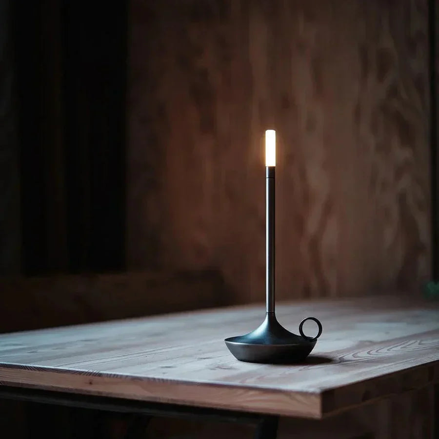 Minimalist cordless LED lamp, providing warm ambient light for modern home decor.