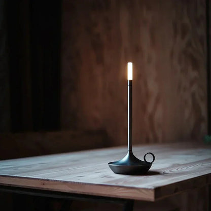 Minimalist cordless LED lamp, providing warm ambient light for modern home decor.