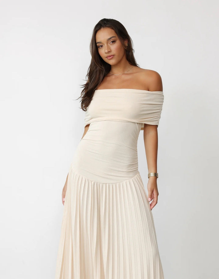 Navy off-shoulder pleated maxi dress, sophisticated special occasion attire.