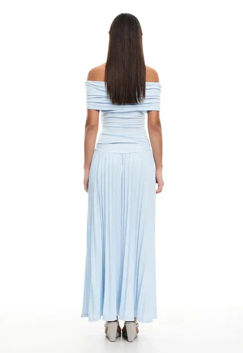 Navy off-shoulder pleated maxi dress, ideal for a refined wedding guest.