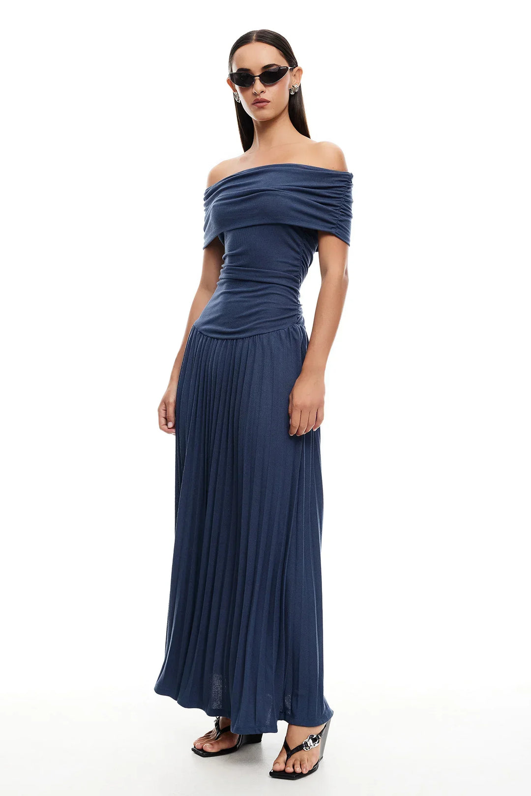 Navy off-shoulder pleated maxi dress, a sophisticated evening wear choice.