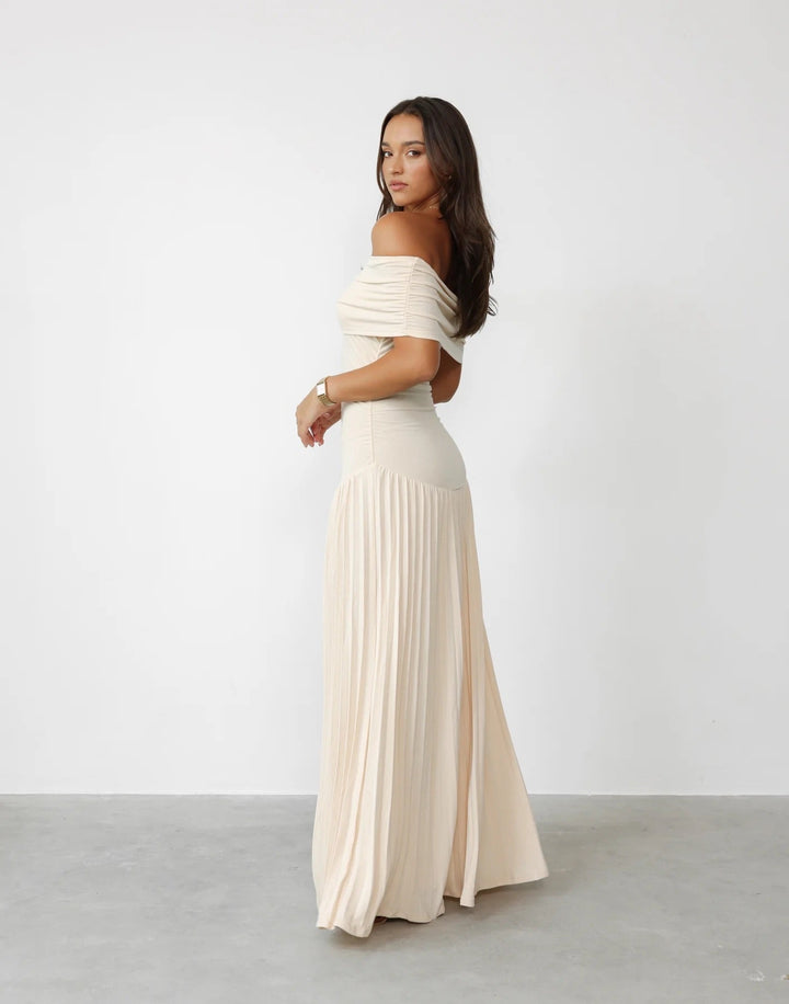Women's cream pleated off-shoulder maxi dress, ideal for special events.