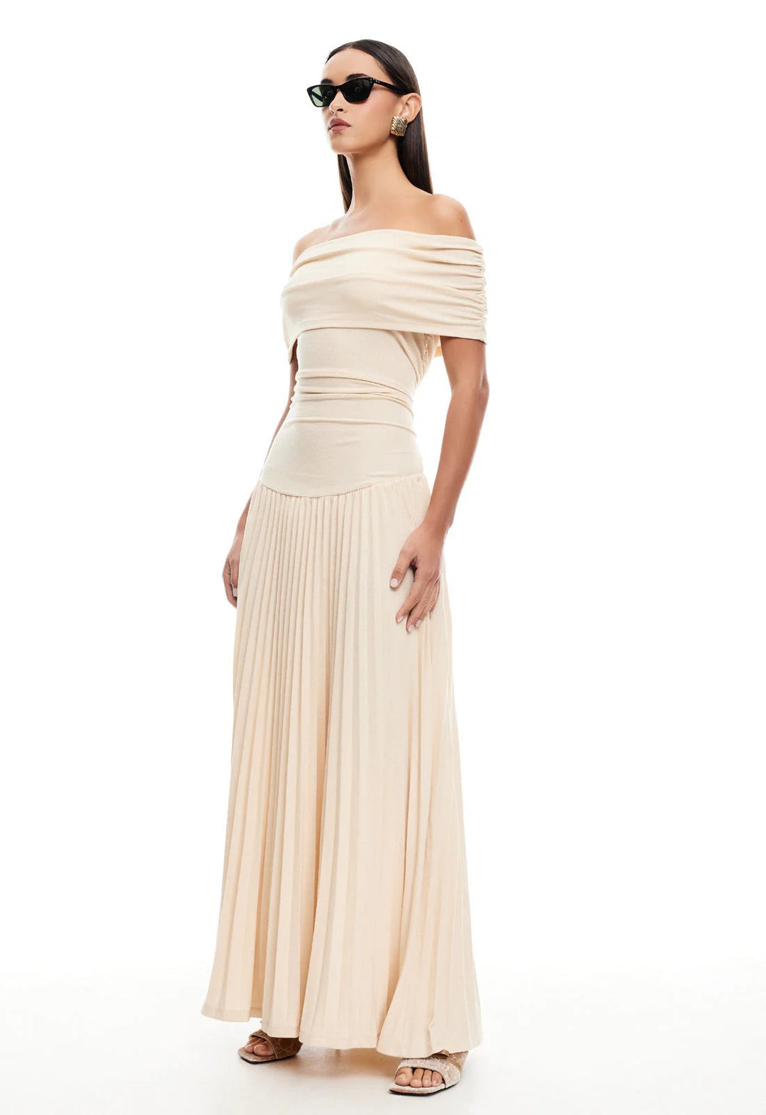 Elegant cream off-shoulder pleated maxi party dress, stunning fashion.