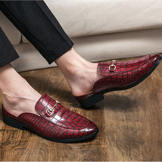 Sophisticated women's croc-print slip-on mules, ideal elegant footwear for casual or formal style.