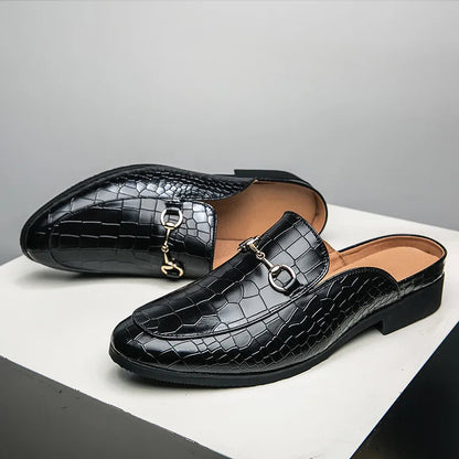 Stylish women's croc-embossed slip-on mules, comfortable and chic footwear with unique print and horsebit.