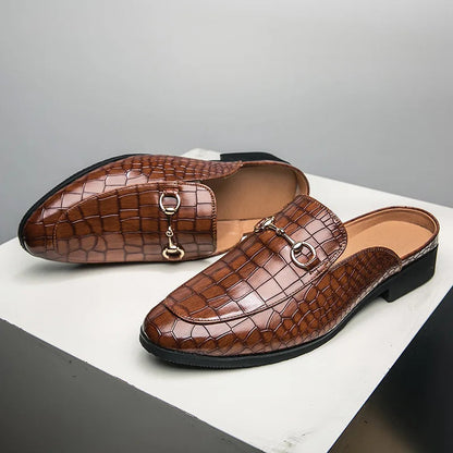 Women's elegant croc-embossed slip-on mules. Versatile, comfortable footwear with a sophisticated croc print.