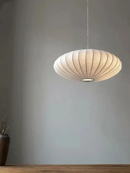 Luxurious pendant lamp, perfect for elegant interior design, with crystal accents & silk.