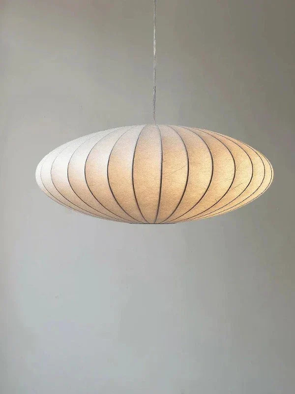 Create an opulent ambiance with this elegant crystal pendant lamp & its beautiful silk shade.
