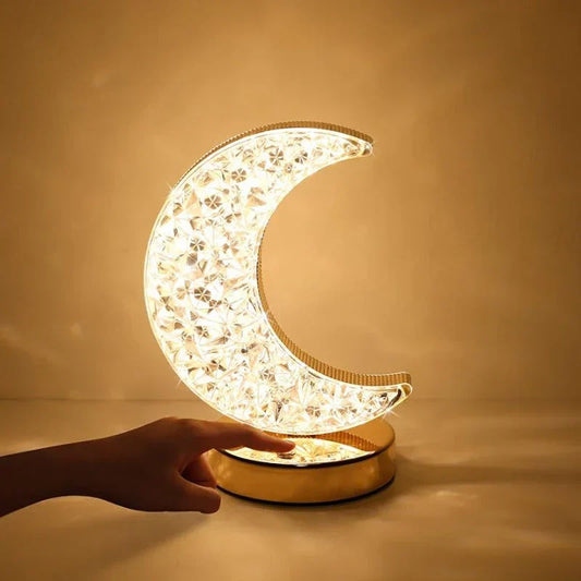 Elegant crystal table lamp with moon & star forms, perfect for bedroom decor. Dimmable LED accent light for home.