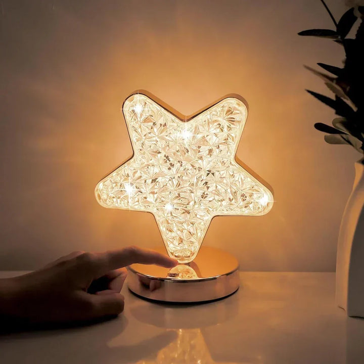 Dimmable LED crystal moon & star table lamp, creating a soft mood light for bedroom or home decor.