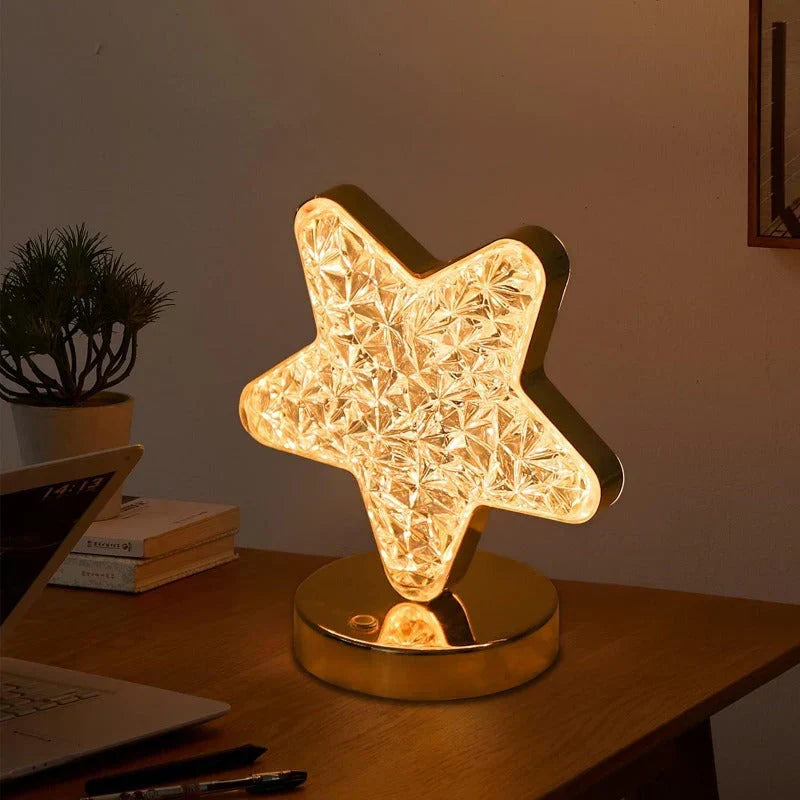 Decorative LED crystal table lamp with moon and star design, ideal as a dimmable mood light for any room.