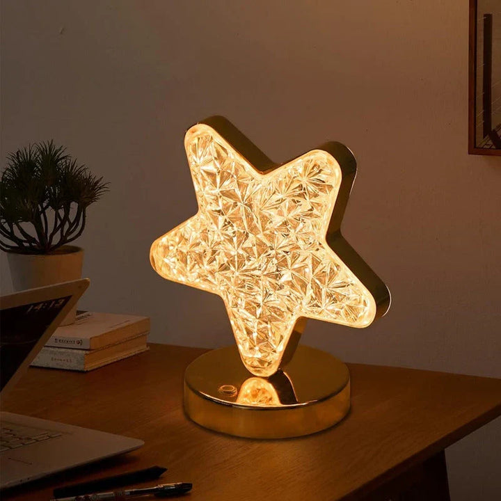 Decorative LED crystal table lamp with moon and star design, ideal as a dimmable mood light for any room.