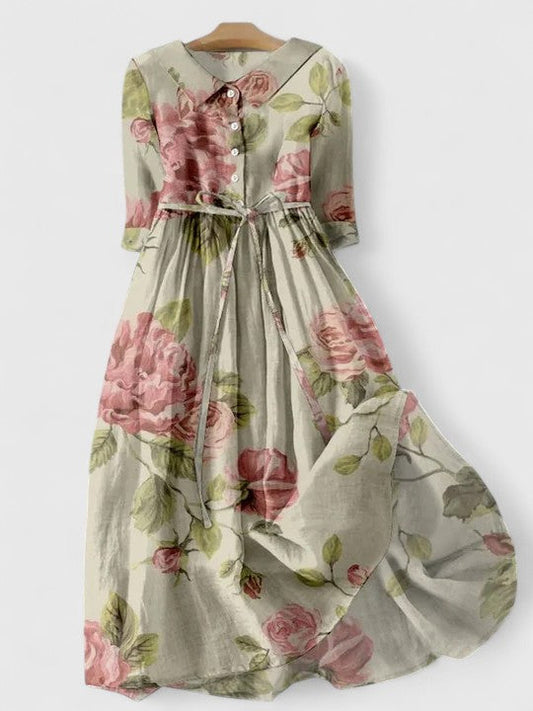Elegant early spring midi dress for women, with adjustable waist, pink floral print, comfortable for casual day wear.