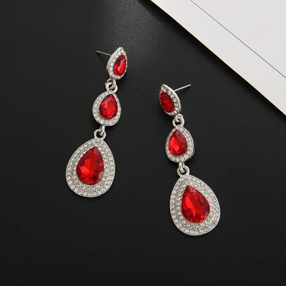 Vibrant emerald green cascade drop earrings, an elegant stainless steel gift for her. Dangle style.