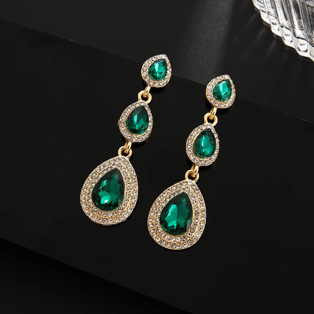 Statement emerald cascade dangle earrings, vibrant green & elegant stainless steel jewelry for women.