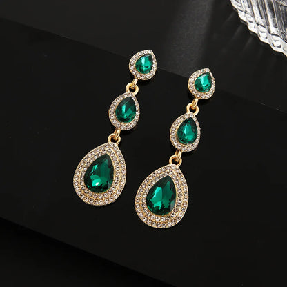 Statement emerald cascade dangle earrings, vibrant green & elegant stainless steel jewelry for women.