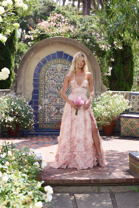 Vibrant floral pattern maxi dress with a flattering V-neck & delicate ruffles, great for any occasion.
