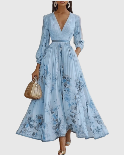Graceful women's pleated maxi dress with elegant floral pattern, V-neck, ideal for formal wear.